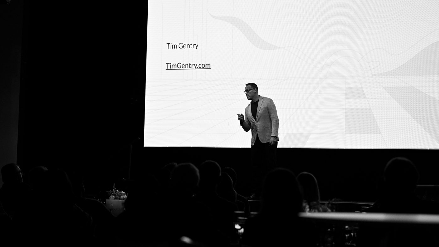 Dr. Timothy H. Gentry: Go Teach It keynote Dr. Timothy H. Gentry (Tim Gentry) delivering 'Go Teach It': a keynote on reducing time to correction through repeatable AI adoption, member-organization audience, 2026